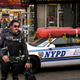 A police officer patrols Brooklyn in the new NYPD uniform.